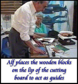 Alf places wooden blocks